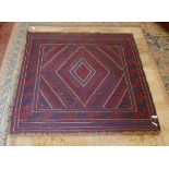 A red and blue patterned wool rug - Approx size: 121cm x 115cm
