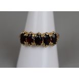 Gold 5 stone garnet ring - Approx size: Q½