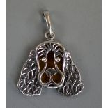 Silver and amber dog pendant