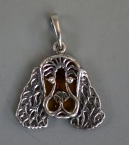 Silver and amber dog pendant