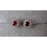 Pair of gold, ruby and diamond earrings