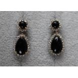 Pair of gold cabocheon garnet and diamond earrings