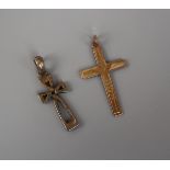 Gold crucifix together with a silver crucifix