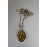 Large silver and amber pendant on chain