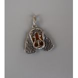 Silver and amber dog pendant