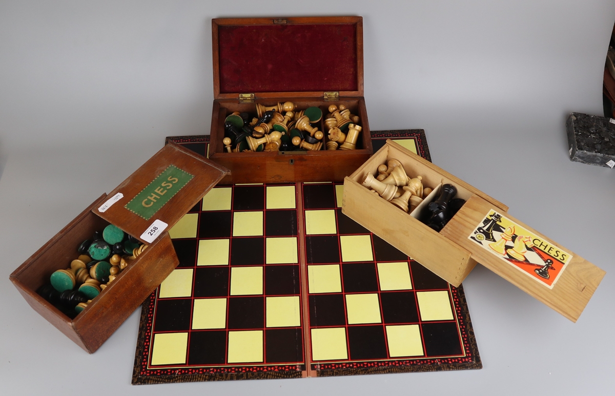 3 chess sets and a board