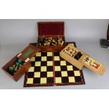3 chess sets and a board