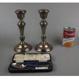 Pair of hallmarked silver candlesticks together with hallmarked silver spoon