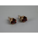 Pair of gold garnet set earrings