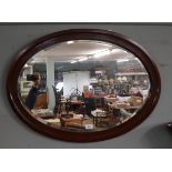 Antique bevelled glass oval mirror
