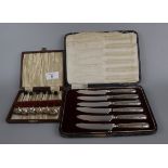 Cased set of 7 hallmarked silver spoons together with a cased set of silver handles knives