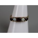 Gold opal & garnet set ring - Approx size: M