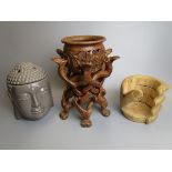 Interesting wooden plant stand together with bottle holder and ceramic Buddha head