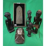 Collection of African tribal figures together with a framed plaque of a dancing Buddha