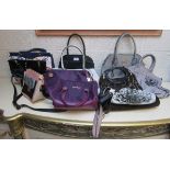 Collection of handbags to include Michael Kors