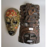 2 carved tribal masks