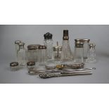 Collection of silver top bottles etc