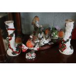 Collection of robin ornaments to include a pair of Christmas candlesticks