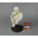 Cast iron Michelin man on spinning stool