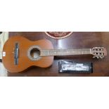 JHS Encore classical acoustic guitar together with a novelty miniature guitar