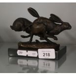 Bronze figure of running hares