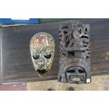 2 carved tribal masks