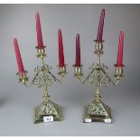 Pair of brass candelabra to include candles