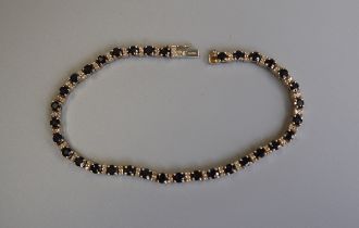 Gold sapphire & diamond tennis bracelet
