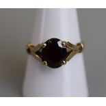 Gold garnet set ring