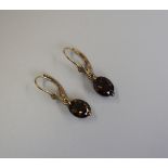 Pair of gold topaz drop earrings