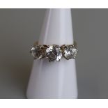 Gold cubic zirconia three stone ring