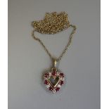 Gold ruby & diamond heart shaped pendant on gold chain