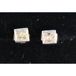 Pair of 18ct gold earrings set with princess cut diamonds