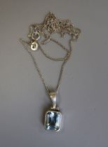 Silver blue topaz pendant on chain