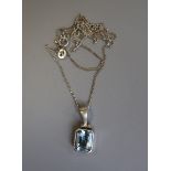 Silver blue topaz pendant on chain