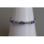 White gold tanzanite & diamond set ring - Size M½