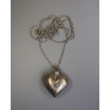 Large silver heart pendant on silver chain