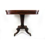 An early 19th century rosewood tea table,