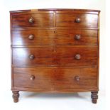 A 19th century mahogany and banded bow front chast of two short over three long drawers on turned