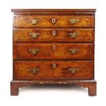 An early 18th century and later walnut and banded chest of four long graduating drawers,