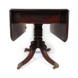 An early 19th century mahogany pembroke table,