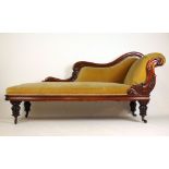 A Victorian mahogany chaise longue upholstered in a cut green fabric,