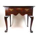 An 18th century oak single drawer side table,