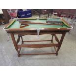 A child's snooker table with cues, balls, rest,