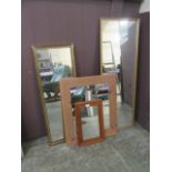 Four assorted framed wall mirrors