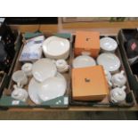 Two trays of white ceramic tableware to include plates, teapots,