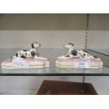 A pair of Staffordshire dogs on bases