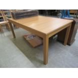 A modern oak effect extending dining table