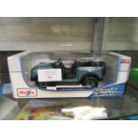 A boxed 1:18 die cast model of a Ford Bronco