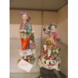 Two continental ceramic figures of boys (A/F)